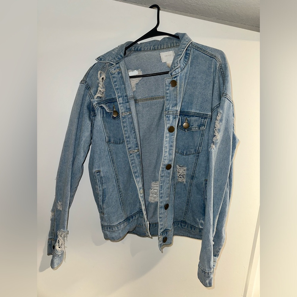 Distressed Jean Jacket size Medium fits like Large